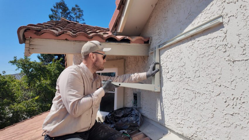 best-time-to-buy-an-air-conditioner-2 Professional servicing AC in spring which is the best time to buy an air conditioner